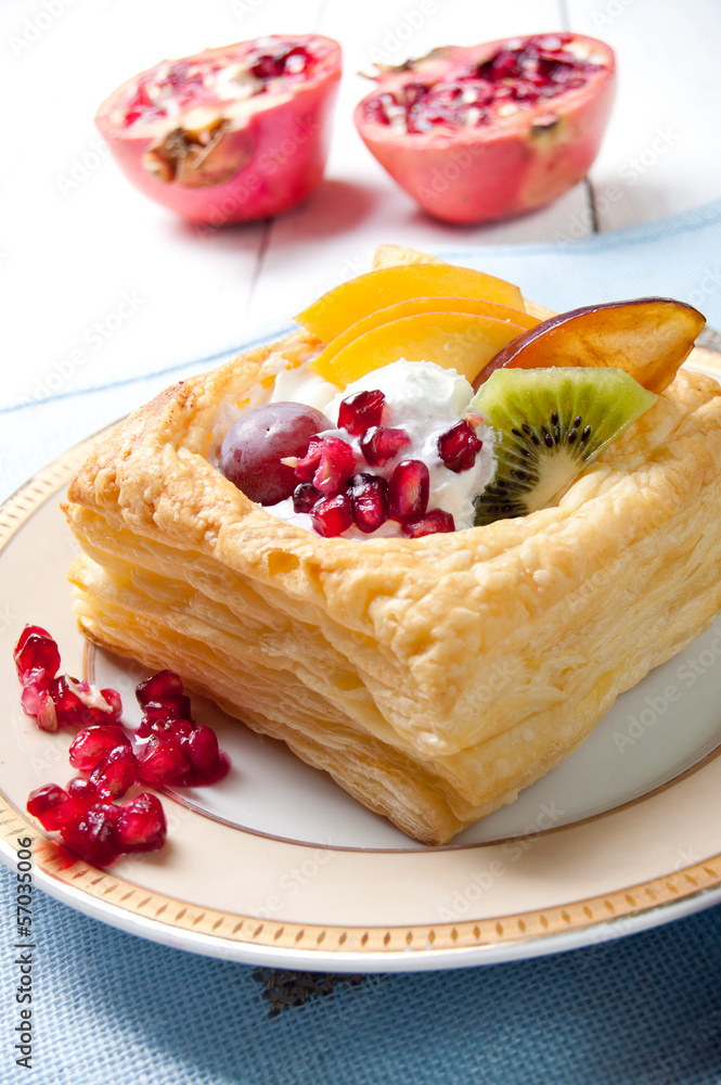 Delicious puff pastry with cream and fruits Delicious puff pastry with cream and fruits