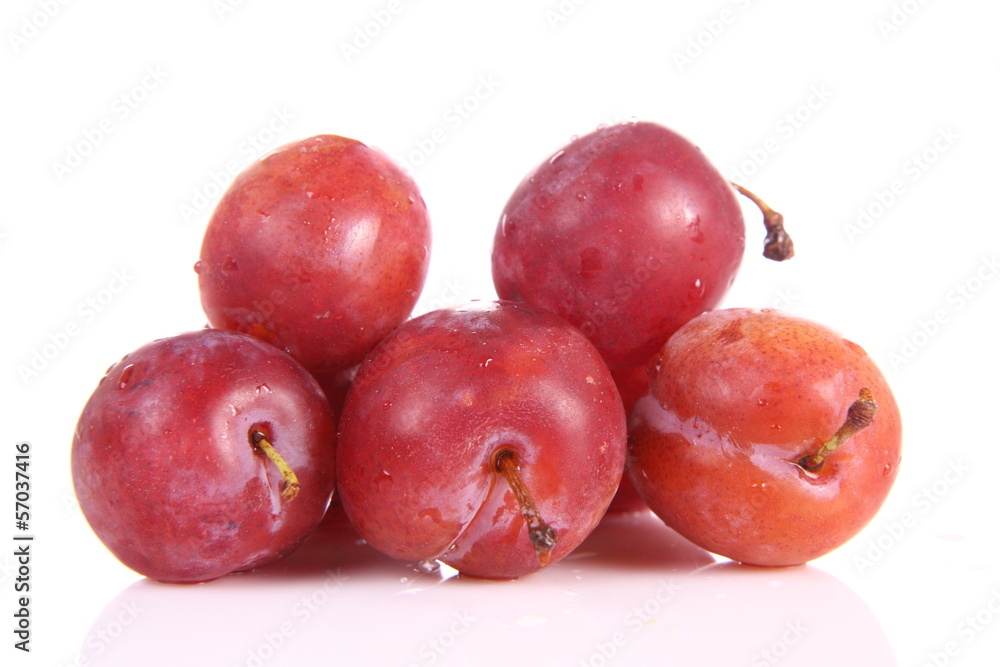 Plums on white background
