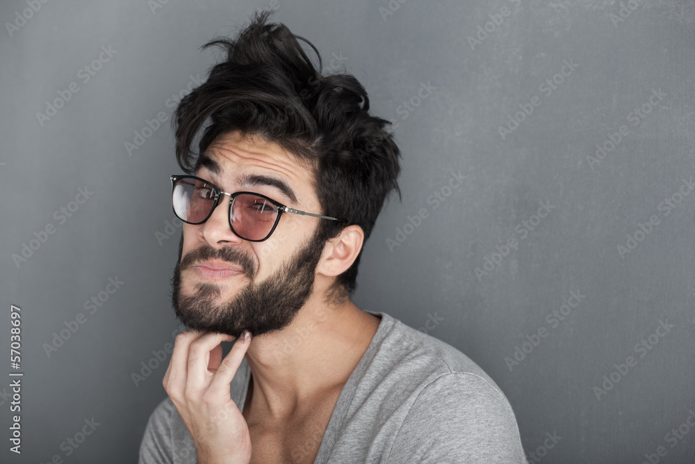 sexy man rubbing his beard against wall sexy man rubbing his beard against wall