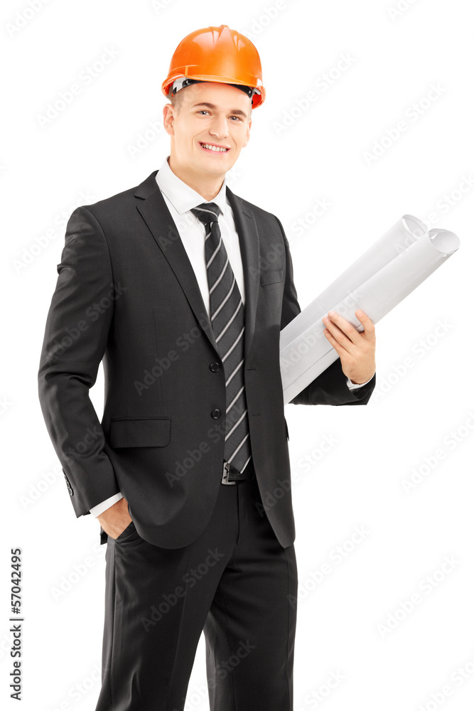 Young male architect wearing helmet and holding blueprint Young male architect wearing helmet and holding blueprint