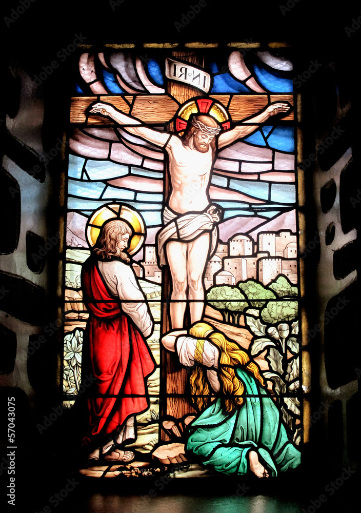 Colorful window with the image of the crucified Jesus