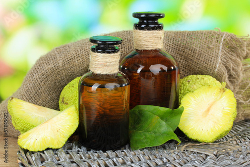 Osage Orange fruits (Maclura pomifera) and medicine bottles, photo