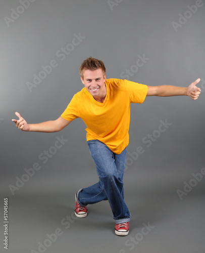 Handsome young man dancing ...