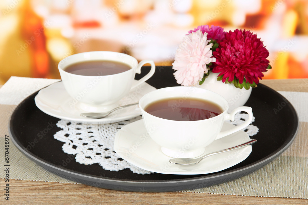 Cups of tea on tray on table in cafe Cups of tea on tray on table in cafe