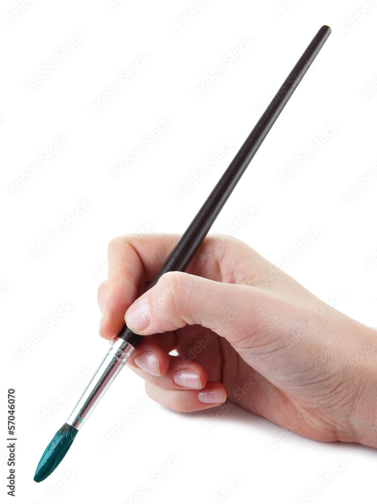 Hand holding brush with green paint isolated on white Hand holding brush with green paint isolated on white
