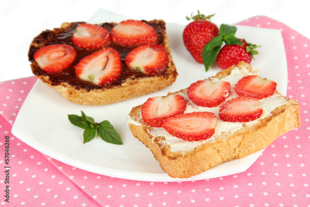 Delicious toast with strawberry on plate close-up Delicious toast with strawberry on plate close-up