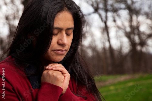 Woman Praying Outdoors
