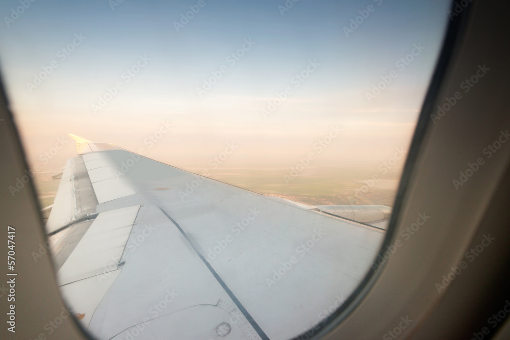 Looking through window aircraft during flight in wing Looking through window aircraft during flight in wing