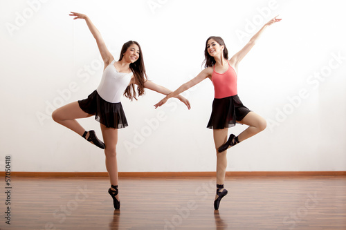 Happy ballet dancers in a studio