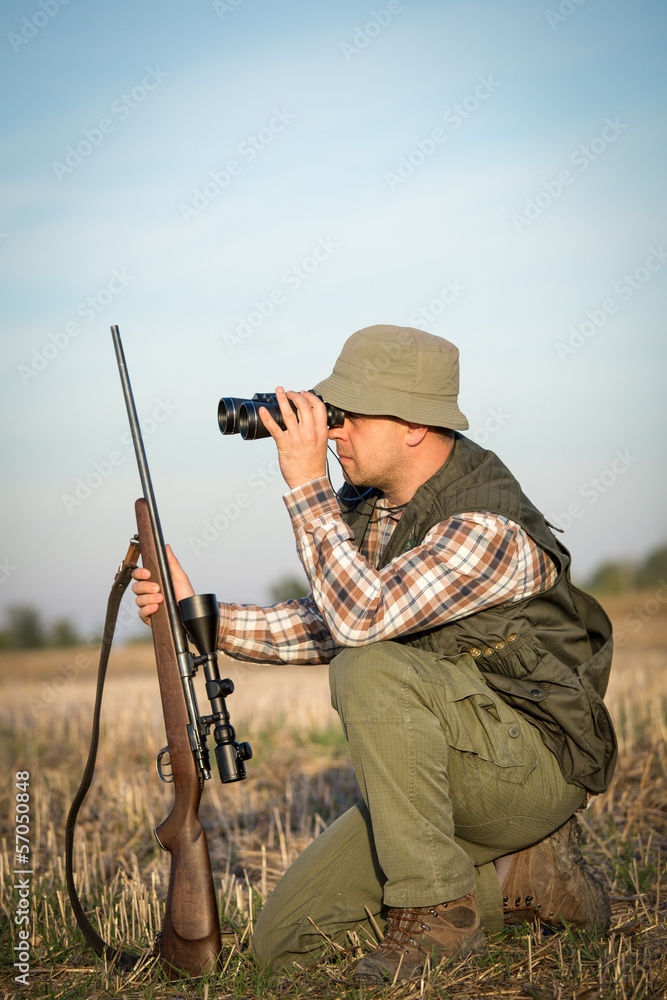 Fototapeta premium hunter in the hunting shirt and trousers in the hunt
