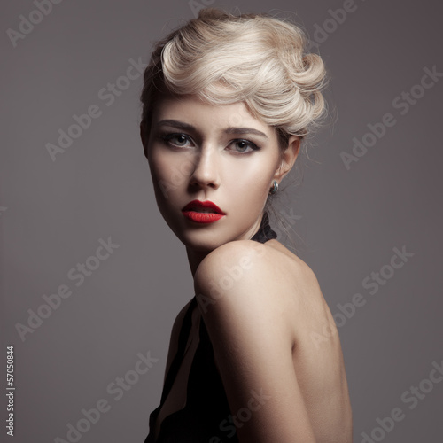 Beautiful Blonde Woman. Retro Fashion Image.