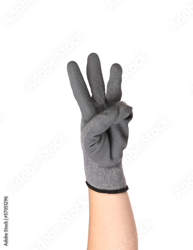 Hand shows three in rubber glove.