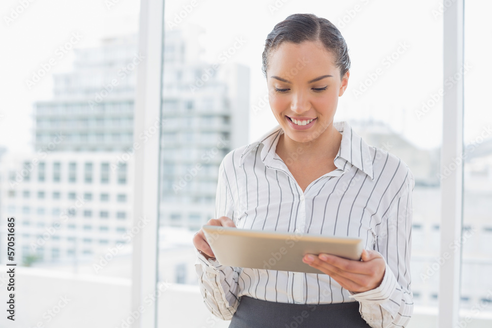 Attractive businesswoman using tablet pc