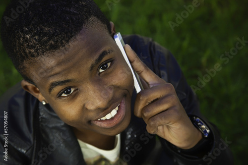 african boy on cell phone outside