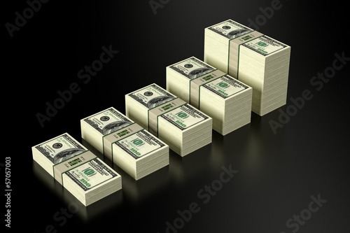 Stacks of 100 Dollar banknotes on glossy surface