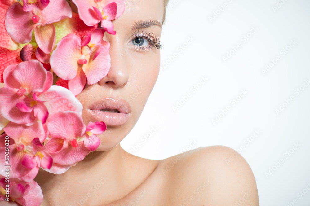 Beautiful girl face & pink flowers, perfect skin