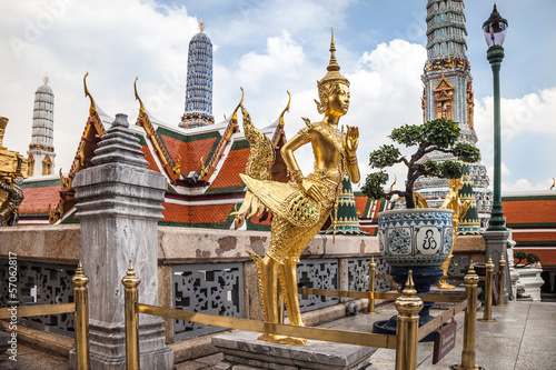 Photography Golden Kinnara statue at the temple in Grand Palace, Bangkok