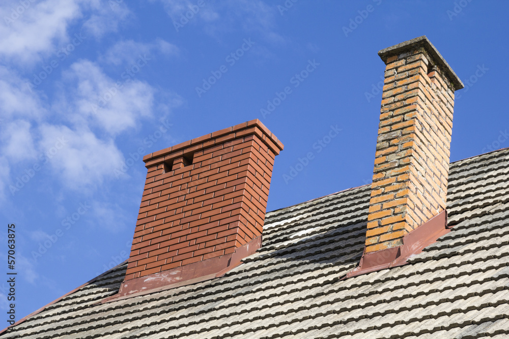 two brick chimneys on the roof