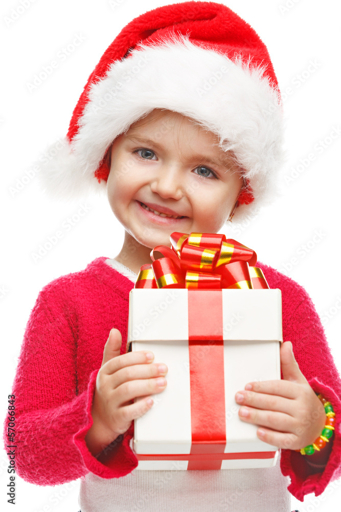 Happy girl with gift box near the Christmas tree. Happy girl with gift box near the Christmas tree.