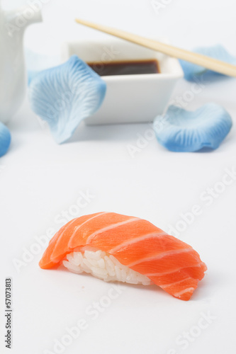 Salmon sushi nigiri with soy sauce and chopsticks