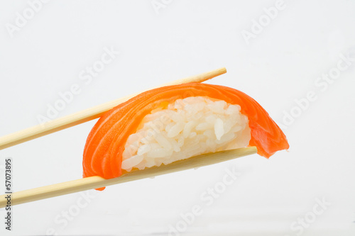 Salmon sushi nigiri with chopsticks