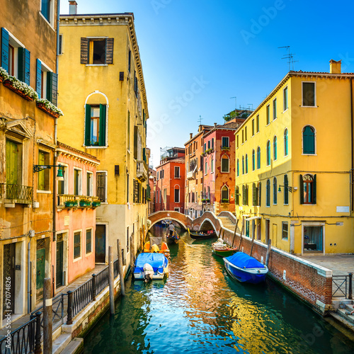 Venice cityscape, buildings, boats, canal and bridge. Italy