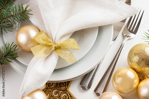 Christmas table setting in gold tones