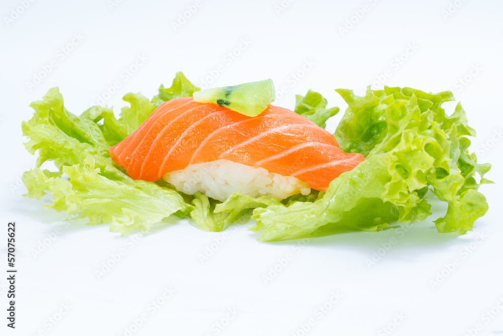 Salmon sushi nigiri with salad in hand