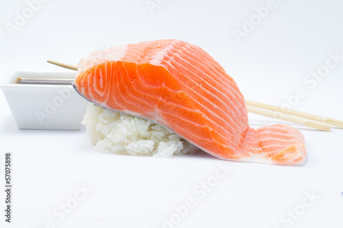 Salmon fillet like nigiri with rice and soy sauce