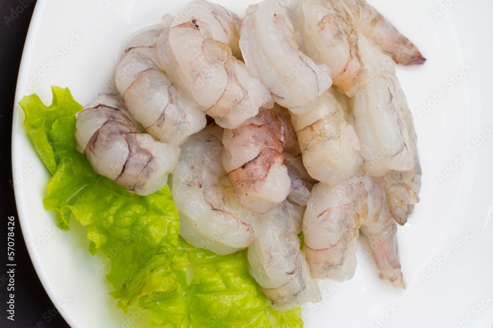 Roe shrimp with salad on white plate Roe shrimp with salad on white plate