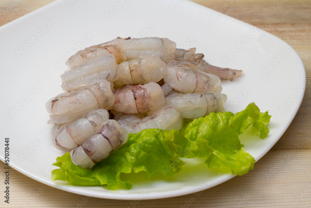 Roe shrimp with salad on white plate Roe shrimp with salad on white plate