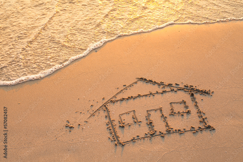House painted on beach sand.