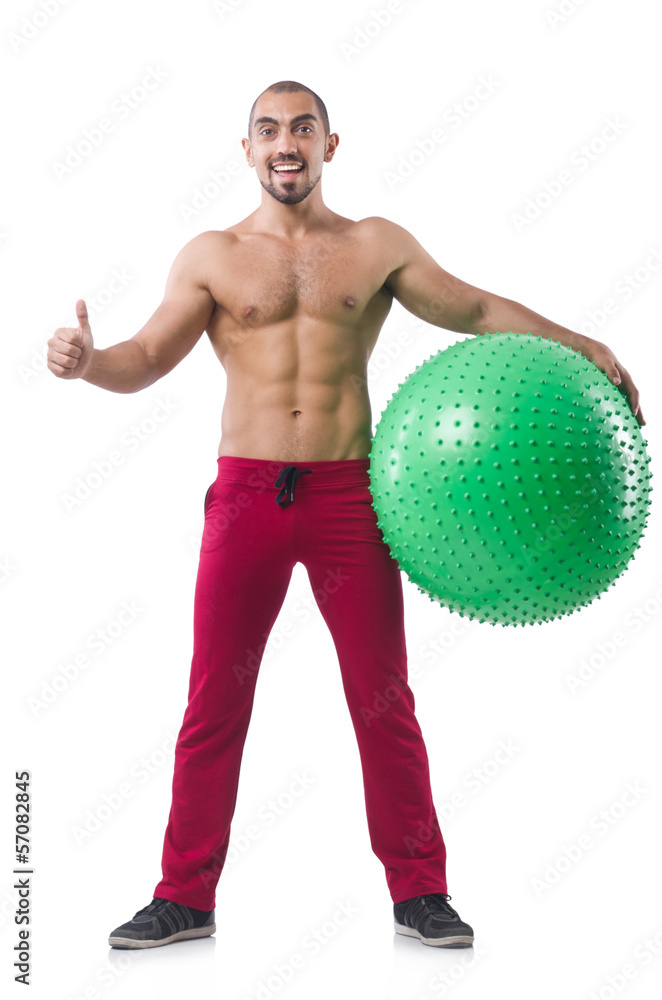 Man with swiss ball doing exercises on white Man with swiss ball doing exercises on white