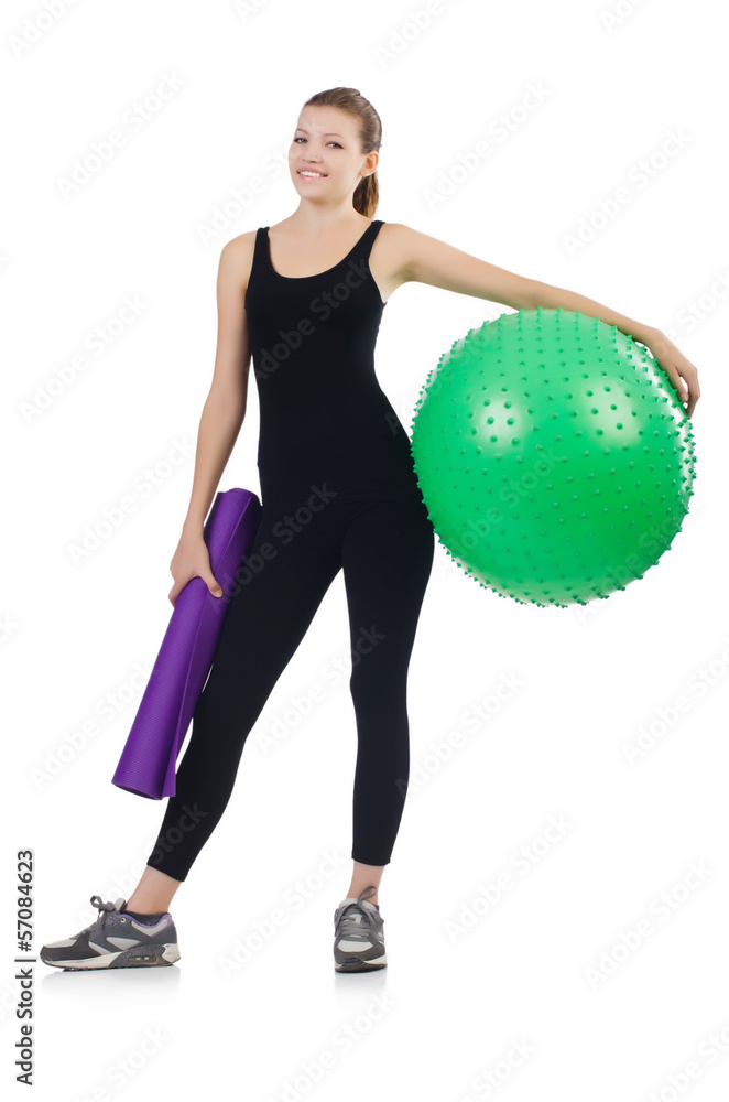 Young woman with ball exercising on whitee