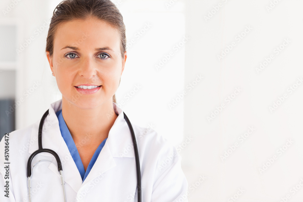 Portrait of a beautiful brunette doctor with a stethoscope Portrait of a beautiful brunette doctor with a stethoscope