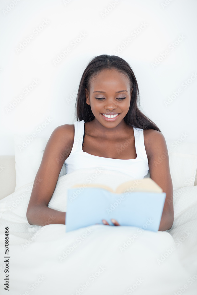 Portrait of a young woman reading a book Portrait of a young woman reading a book