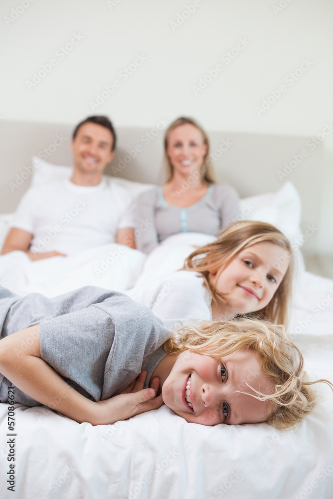 Family taking a rest on the bed