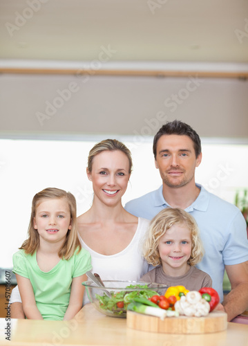 Family standing behind kitchen counter