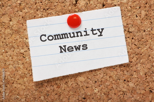 Community News paper note on a cork notice board