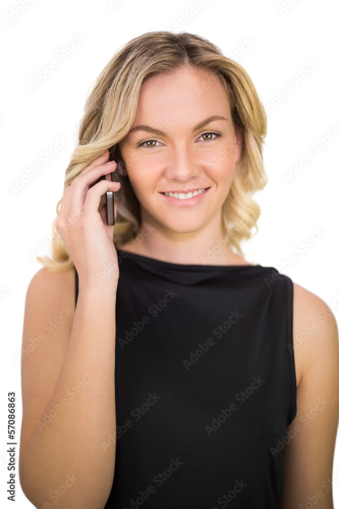 Cheerful gorgeous blonde in black dress on the phone Cheerful gorgeous blonde in black dress on the phone