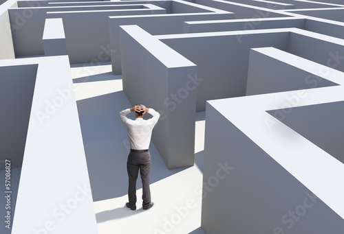 Konstfotografi Rear view of businessman standing in maze