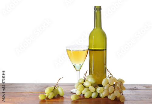Bottle of white wine and grape isolated over white