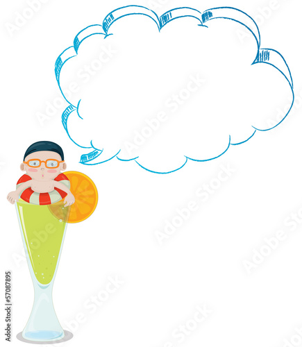 A big glass of lemon juice with a boy swimming