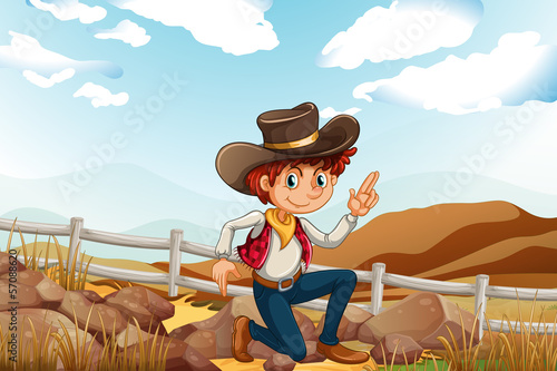 A young explorer at the hilltop near the rocks