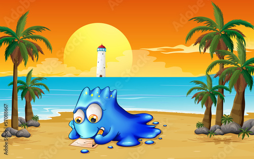 A blue monster writing at the beach