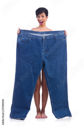 Woman in dieting concept with big jeans