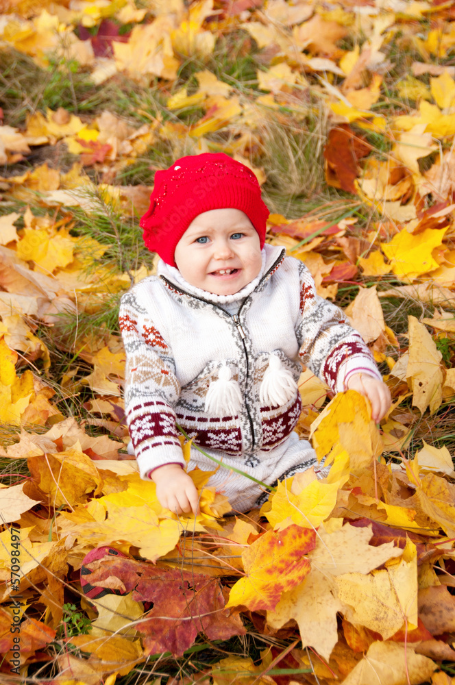 Little cute baby girl on a background of autumn leaves Little cute baby girl on a background of autumn leaves