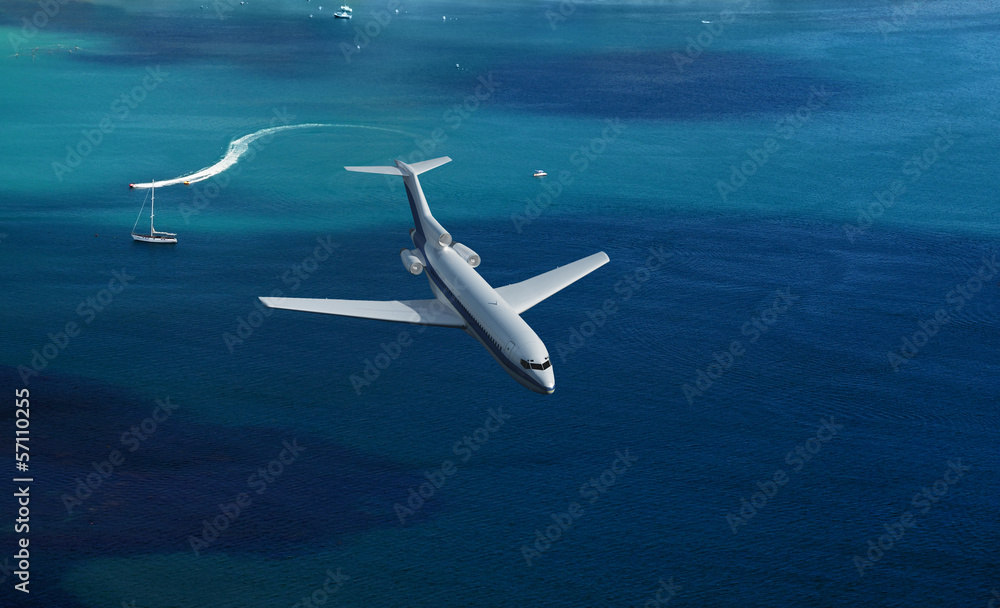 Fototapeta premium airplane flies over a sea