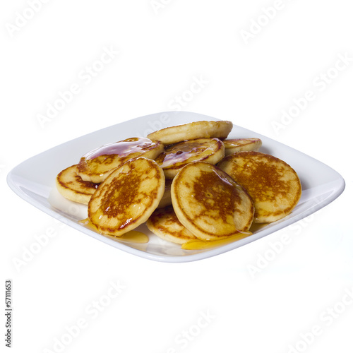 Pancakes with honey on square plate isolated. Delicious Dessert