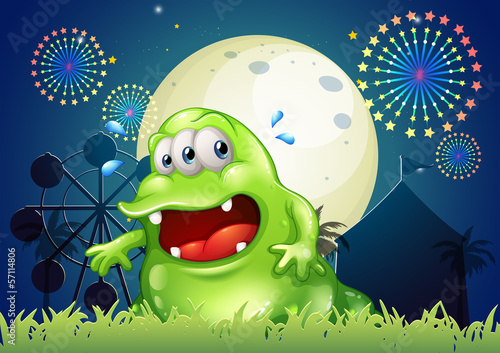 A sweaty green monster in front of the amusement park